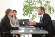 Parents talking to troubled teen counselor about bootcamps or bratcamps